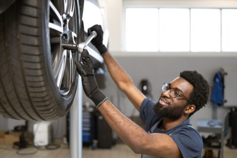 Genuine Mini Mechanic Servicing a Car In Portland, OR