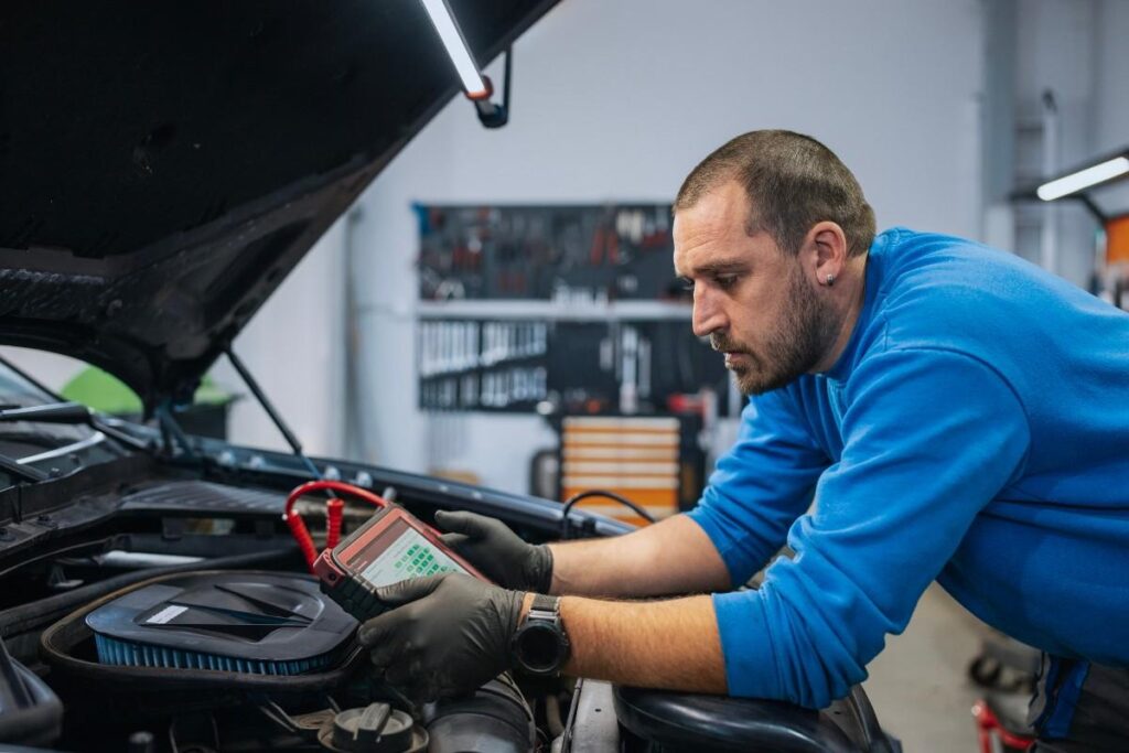 Checking Battery Cables and Connections for Damage in a BMW vehicle by Boyd Motor Werks